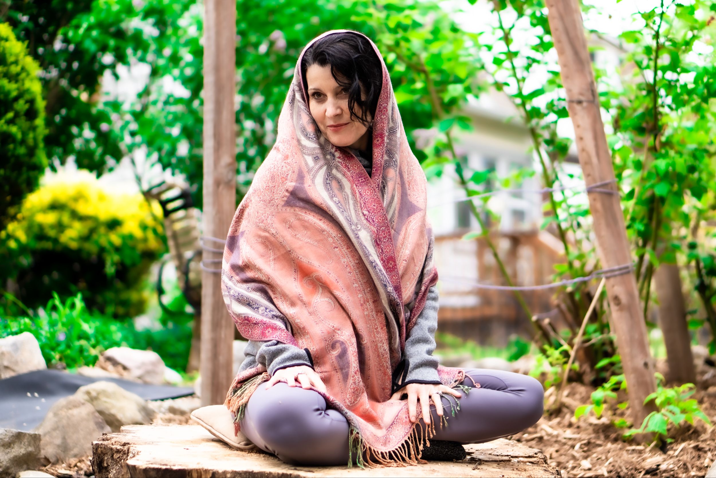 Donna Lakes seated outdoors in a garden